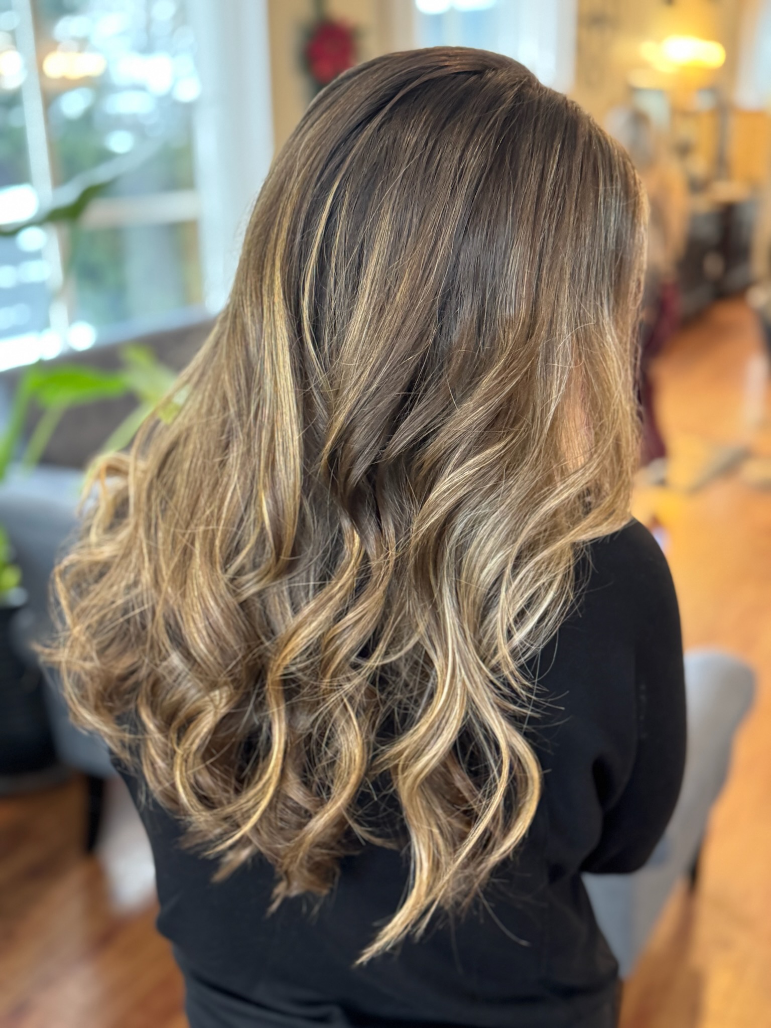 Brunette balayage finished with soft, bouncy curls
