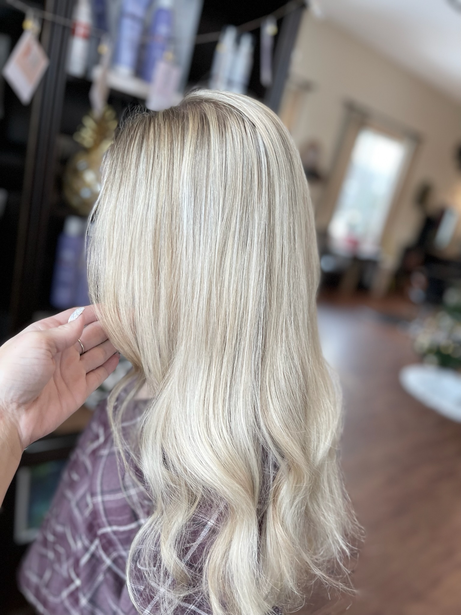 Healthy, shiny platinum blonde hair after bond repair and gloss treatment at JN Couture Salon